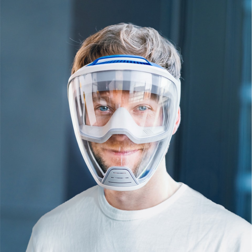 Portrait of a healthcare men wearing the embrace full face mask and smiling